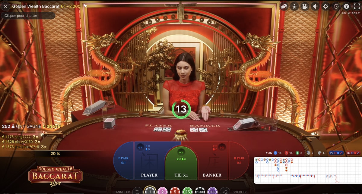 Croupiere a une table de baccarat en live en studio